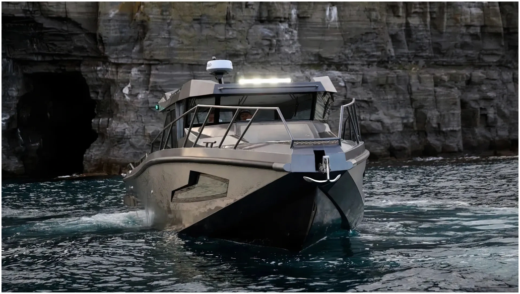 Boat with lights on in a rocky area